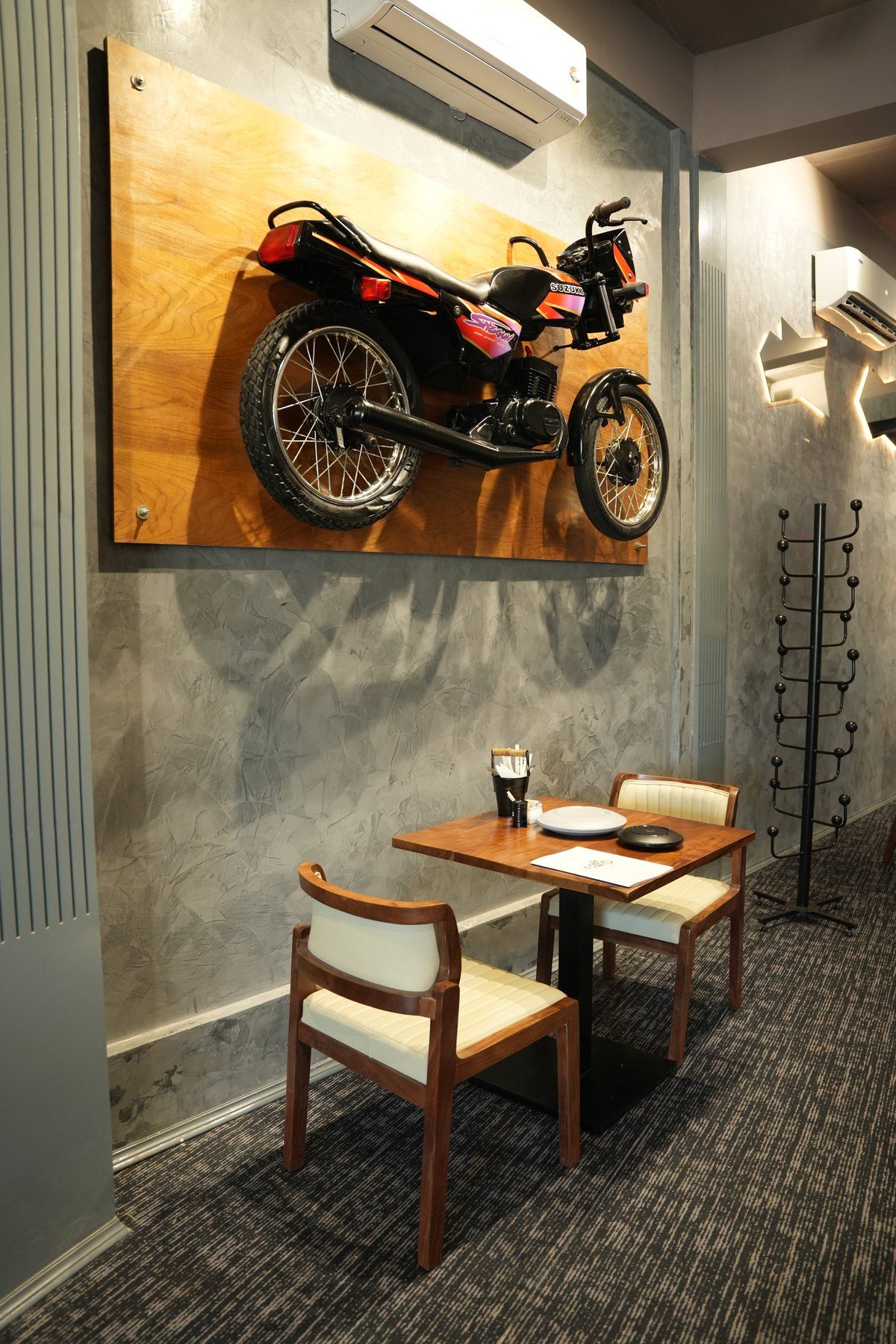 Premium display wall with motorcycle art installation